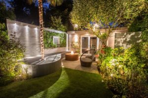 Beautifully lit garden with living wall feature