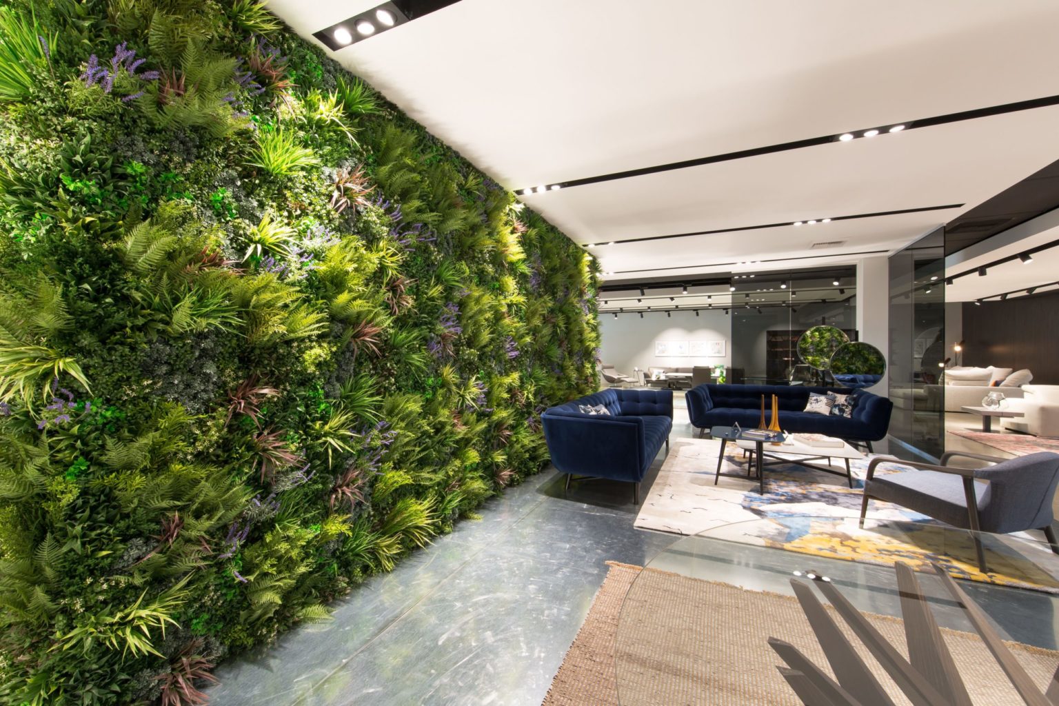 Office wall with artificial plant living wall panels