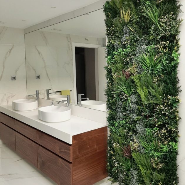 Indoor artificial green walls in modern bathroom