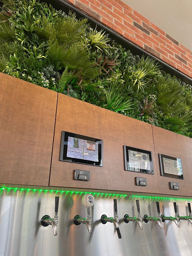 fake living wall above drink dispensers
