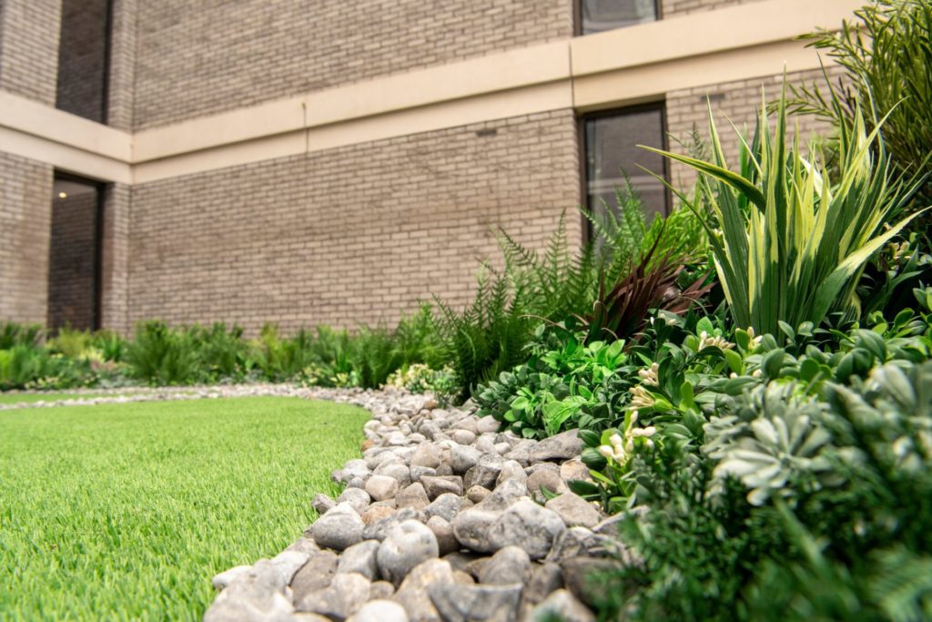 close up of horizontal artificial green roof installation