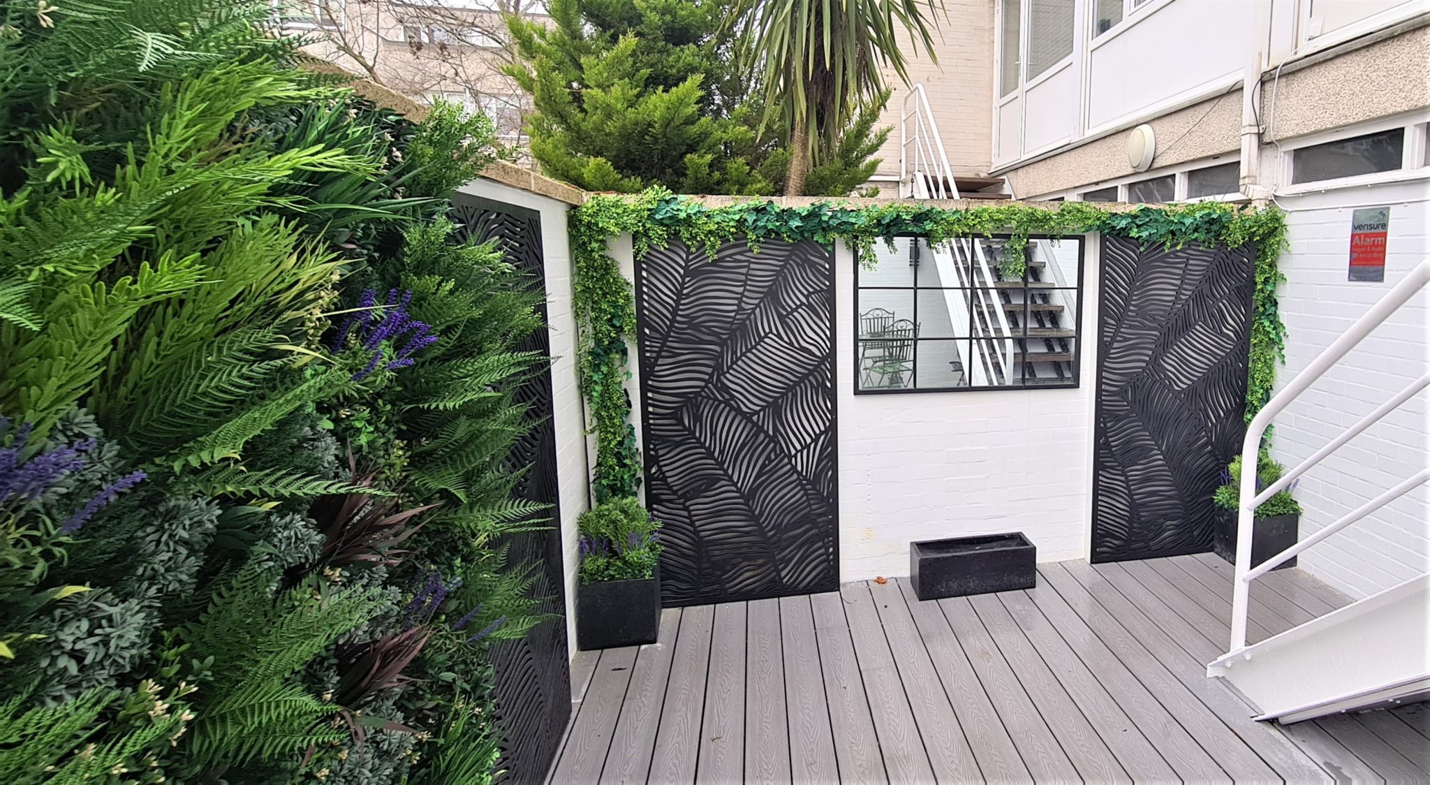 A green wall installation in a windsor courtyard