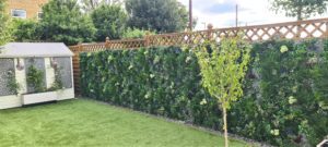 Faux Living Wall Installation on a fence in a private garden